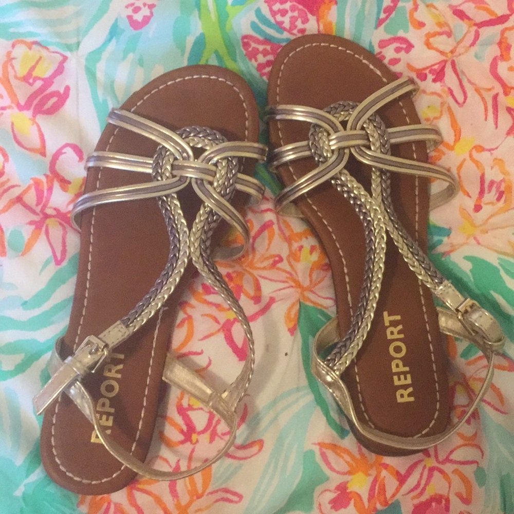 Sandles that are gold and leather
